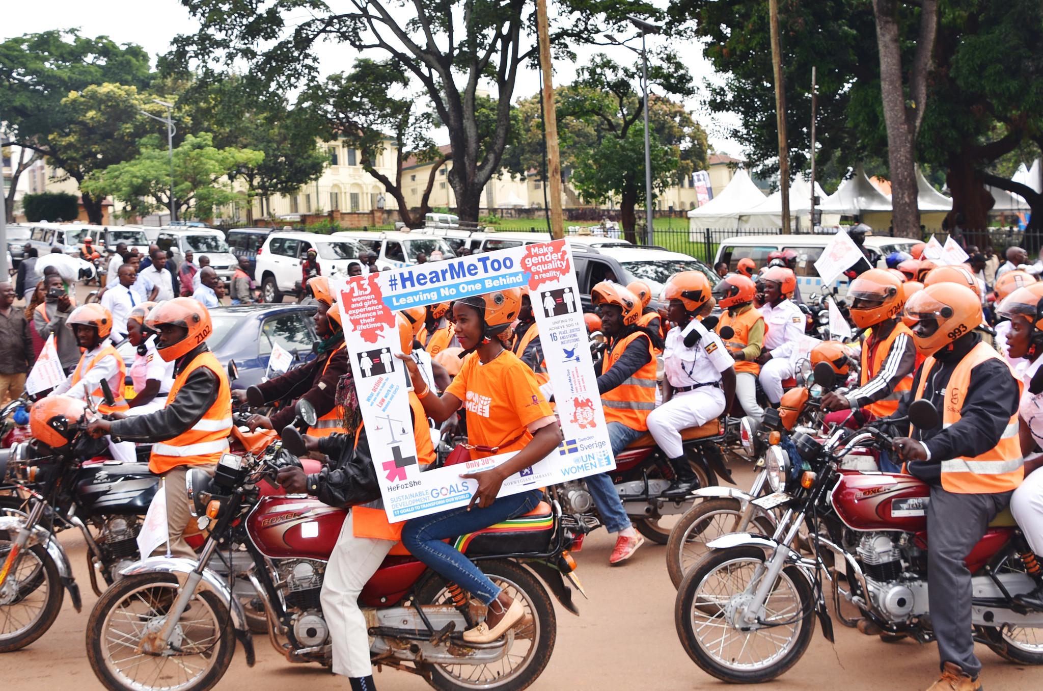 People in Uganda commemorate the 16 Days of Activism against Gender-Based Violence in 2018 with a boda ride. Photo: UN Women/Martin Ninsiima People in Uganda commemorate the 16 Days of Activism against Gender-Based Violence with a bike ride. Photo: UN Women/Martin Ninsiima