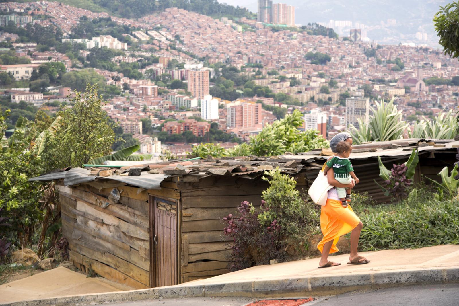 People are crowding into cities at record rates; many end up in poorer neighbourhoods with limited services and infrastructure. Electricity may be sporadic and water quality poor. Easing disparities requires specific actions to reach women, including investment in the public transport systems that many depend on. In this neighbourhood in Medellín, Colombia, most residents come from the countryside, having been displaced by conflict. Some services, like a cable car, have